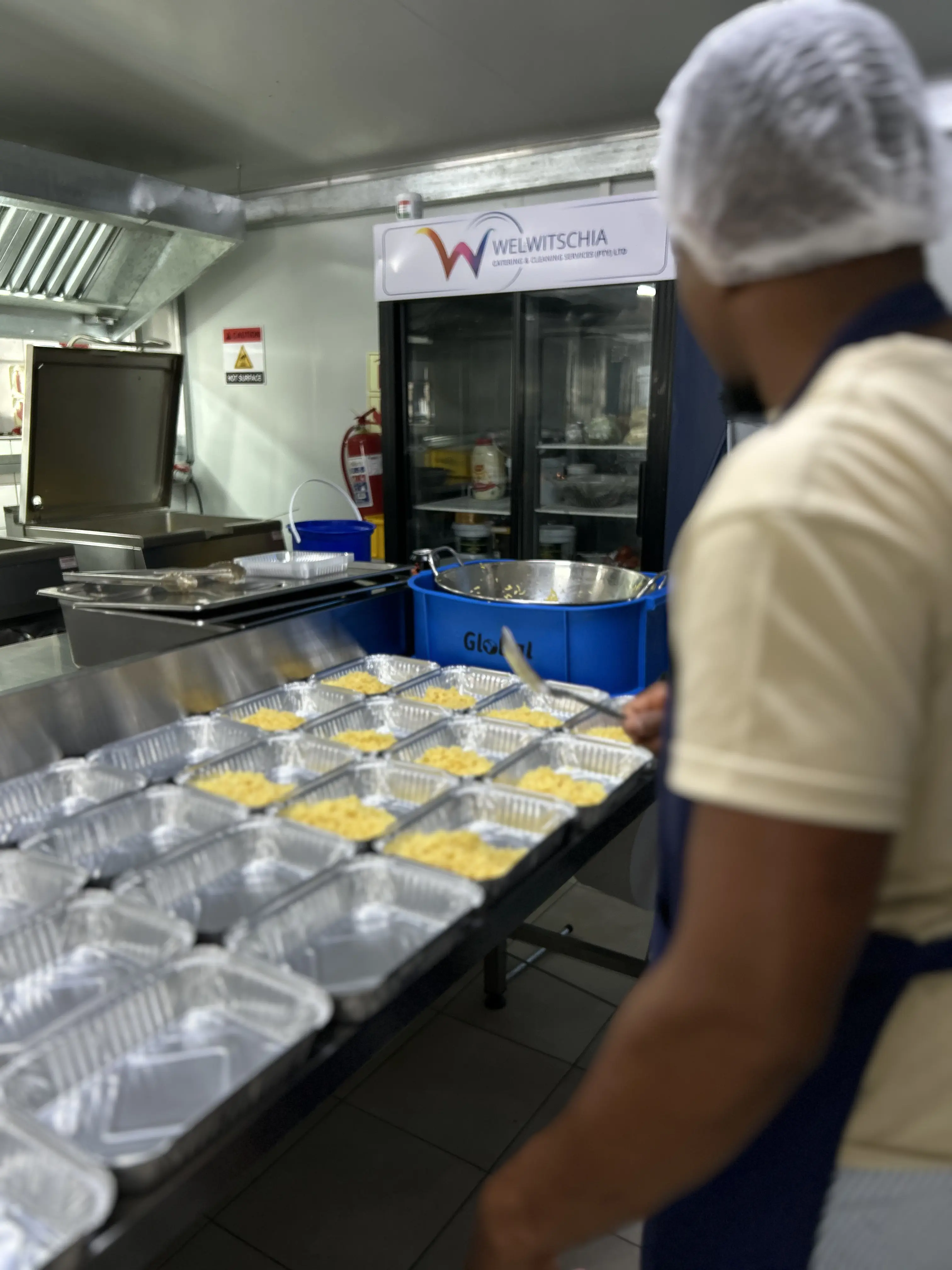 WCCS catering team preparing meals for service